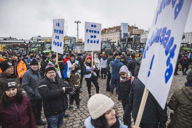 Tractors are parked in market square during &quot;a food march&quot; in Kuopio, central Finland, on Friday March 22, 2024 as farmers protest against perceived inequalities in food production profits. (Akseli Muraja/Lehtikuva via AP)