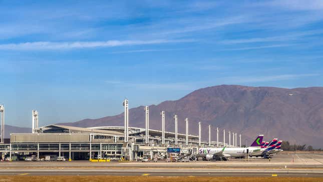 Planes parked at Arturo Merino Benitez International Airport