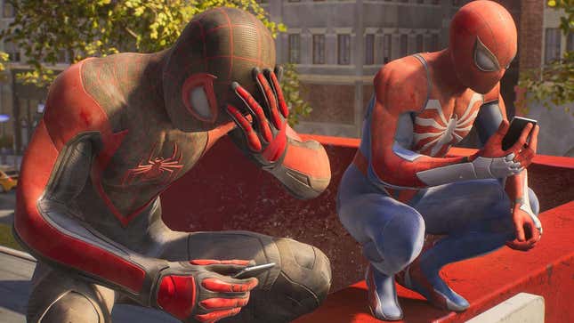 A screenshot shows Spider-Man and Spider-Man hanging out on top of a roof. 