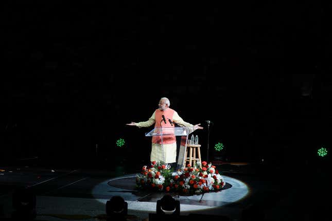 Modi addressing the crowd from a rotating podium. Sunday’s event at Madison Square Garden was the most high profile of his whirlwind US tour.