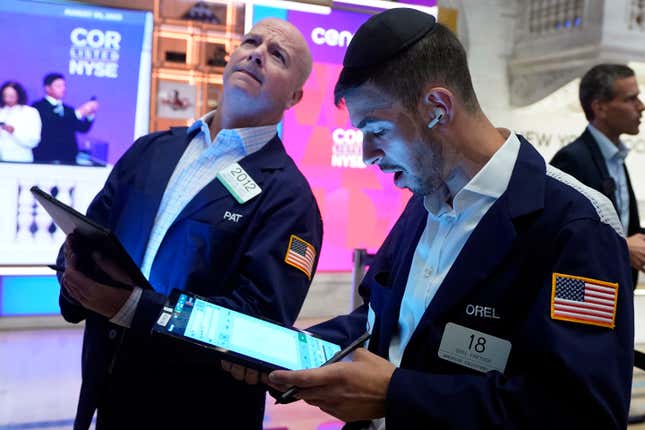 Traders Patrick Casey, left, and Orel Parish work on the floor of the New York Stock Exchange, Wednesday, Aug. 30, 2023. Stocks are edging mostly higher in early trading on Wall Street chipping a bit more away from the market&#39;s losses in August. (AP Photo/Richard Drew)