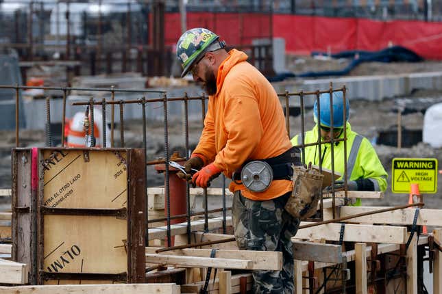 File - A construction worker wires rebar for a foundation, Friday, March 17, 2023, in Boston. On Friday, the U.S. government issues the August jobs report. (AP Photo/Michael Dwyer, File)