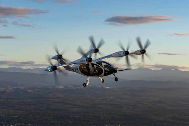 In this 2022 photo provided by Joby Aviation is Joby’s pre-production prototype aircraft in flight above the company’s facilities in Marina, Calif. The same Ohio river valley where the Wright brothers pioneered human flight will soon manufacture cutting-edge electric vertical takeoff and landing aircraft. An agreement announced Monday, Sept. 18, 2023, between the state and Joby Aviation Inc. will bring air taxi production to a 140-acre site at Dayton International Airport by 2025. (Eric Adams/Joby Aviation via AP)