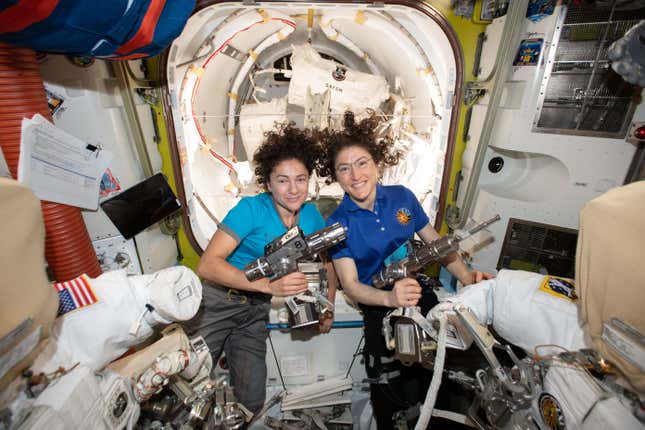 NASA astronauts Jessica Meir (left) and Christina Koch prep for a spacewalk on the International Space Station.