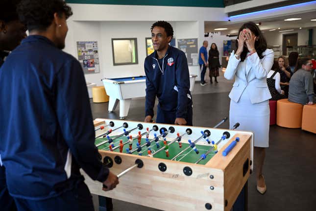 Britain&#39;s Home Secretary Suella Braverman reacts while playing table football during a visit to Bolton Lads and Girls Club in Bolton, Greater Manchester, Tuesday Oct. 3, 2023, on the sidelines of the annual Conservative Party Conference. (Justin Tallis/Pool via AP)