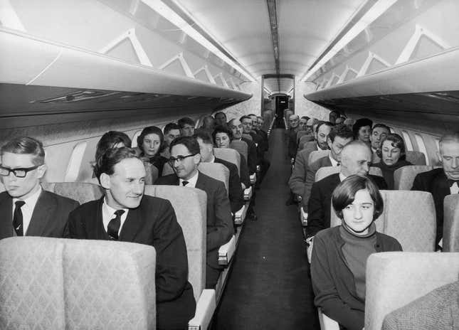 This photo was taken before Amazon invented the Kindle, so you couldn’t read on planes.