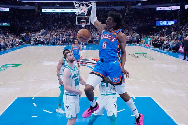 FILE - Oklahoma City Thunder forward Jalen Williams (8) dunks in front of Charlotte Hornets&#39; guard Svi Mykhailiuk (10) in the first half of an NBA basketball game, March 28, 2023, in Oklahoma City. The Oklahoma City Council voted Tuesday, Sept. 26, to set a Dec. 12 citywide vote on a proposed 1% sales tax for six years that would fund a new $900 million downtown arena and keep the NBA&#39;s Thunder in the city through at least 2050. (AP Photo/Sue Ogrocki, File)