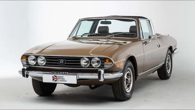 A brown Triumph Stag in a studio photoshoot