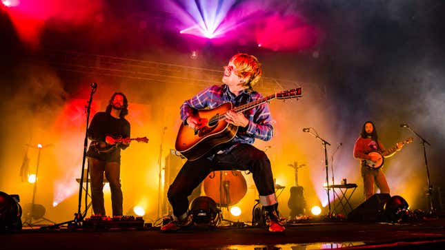 A photo of Billy Strings performing live. 