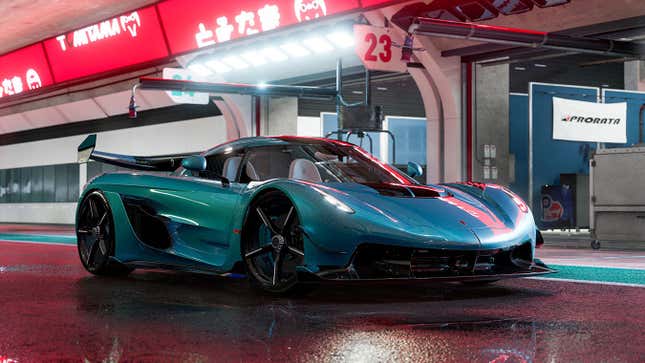 A car sits underneath pink neon lights in the rain. 