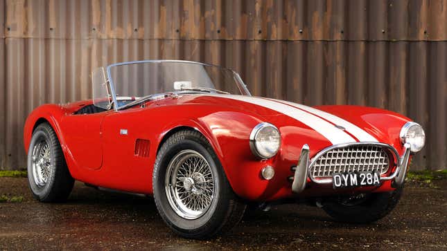 A photo of a red AC Cobra sports car. 