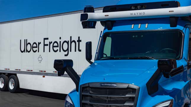 A photo of a Waymo self driving truck towing a trailer with "uber freight" written down the side. 