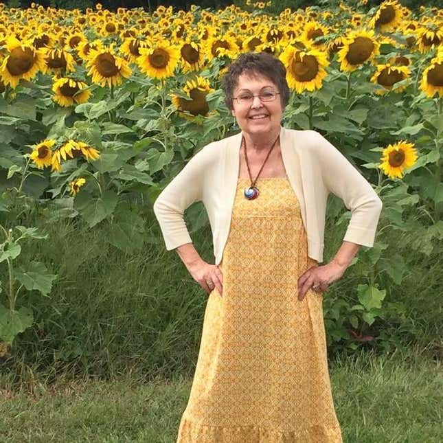 Babette before she passed, standing by a field of her favorite flower.
