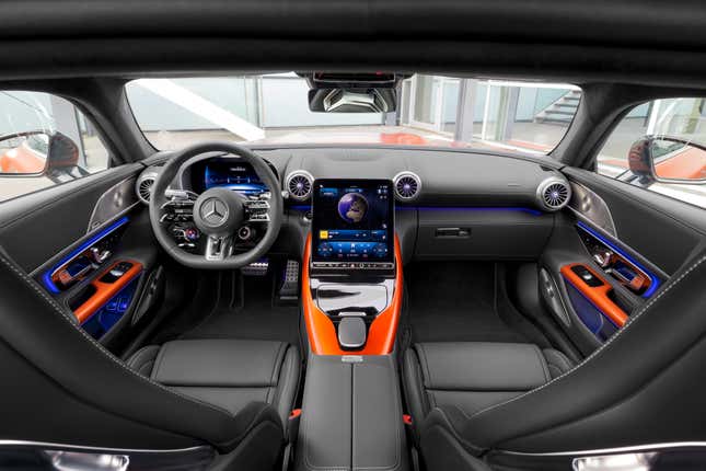Black interior of an orange Mercedes-AMG GT63 coupe