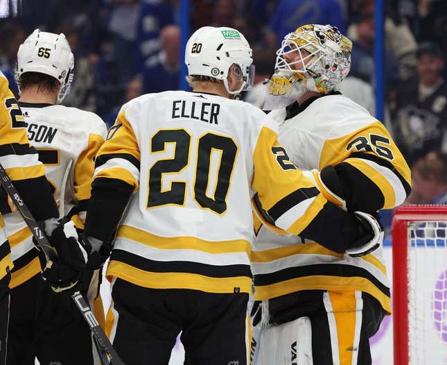 Nov 30, 2023; Tampa, Florida, USA; Pittsburgh Penguins goaltender Tristan Jarry (35) is congratulated after he scored a goal against the Tampa Bay Lightning during the third period at Amalie Arena.