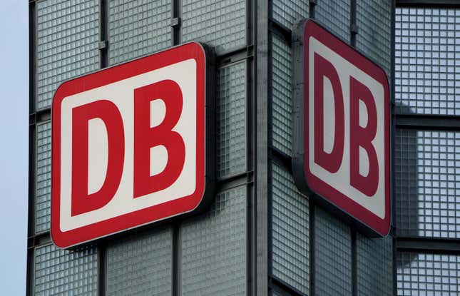 FILE - Two logos of the &#39;Deutsche Bahn&#39; (German Railroad) are pictured at the main train station in Berlin, Germany, Monday, Jan. 3, 2022. Germany&#39;s main national railway operator, Deutsche Bahn, on Tuesday launched an effort to sell its logistics unit, DB Schenker, as the company seeks to concentrate on its core business at home. (AP Photo/Michael Sohn, File)