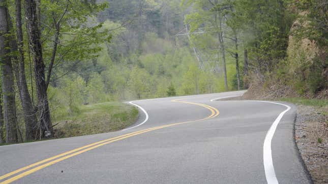 A photo of a twisting ribbon of tarmac. 