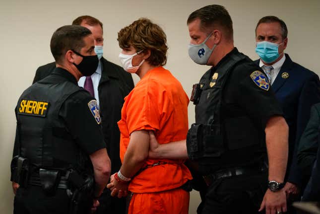 Payton Gendron is led out of the courtroom after a hearing at Erie County Court, in Buffalo, N.Y., Thursday, May 19, 2022.