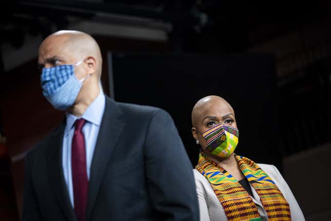 Senator Cory Booker, a Democrat from New Jersey, and Representative Ayanna Pressley, a Democrat from Massachusetts, listen during a news conference unveiling policing reform and and equal justice legislation at the U.S. Capitol in Washington, D.C., U.S., on Monday, June 8, 2020. 