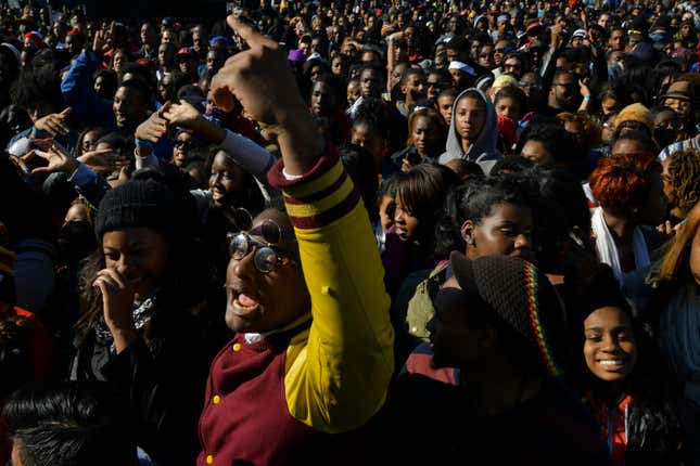 A crowd - including Maxim Fields, a 23-year-old Howard University senior, gathers to cheer on the musical performers at International Yardfest, the centerpiece of Howard University’s Homecoming festivities, on Friday, October 25, 2013, in Washington, DC