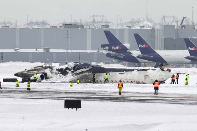 Image for article titled Delta is offering $30,000 to passengers on the plane that crashed and flipped upside down