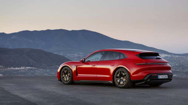 A photo of a red Porsche Taycan GTS Sport Turismo. 