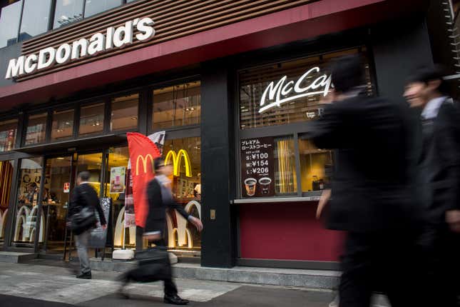 people walk outside a McDonald's in Tokyo, Japan