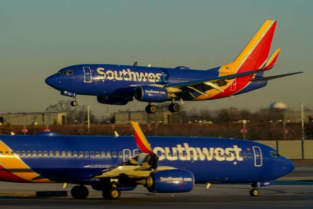 FILE - Southwest Airlines plane prepares to land at Midway International Airport, Feb. 12, 2023, in Chicago. On Monday, Oct. 16, Southwest Airlines announced that it is lowering the requirements to qualify for the top levels of its frequent-flyer program, a move aimed at travelers who are unhappy with other airlines that are making it harder to reach elite status. (AP Photo/Kiichiro Sato, File)