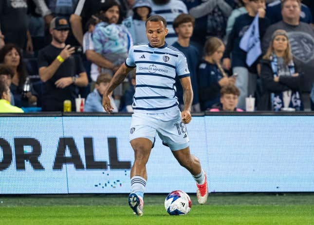 Oct 25, 2023; Kansas City, KS, USA; Sporting Kansas City defender Logan Ndenbe (18) controls the ball during the first half against the San Jose Earthquakes in the Western Conference Wild Card match of the 2023 MLS Cup Playoffs at Children&#39;s Mercy Park.