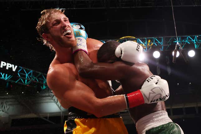 Floyd Mayweather exchanges blows with Logan Paul during their contracted exhibition boxing match at Hard Rock Stadium on June 06, 2021 in Miami Gardens, Florida.