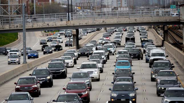  An Illinois State Police officer weaves through heavy traffic while responding to a call on Dan Ryan Expressway before the during the MLB game between the Cincinnati Reds and the Chicago White Sox on April 12, 2024, at Guaranteed Rate Field in Chicago, Illinois. 