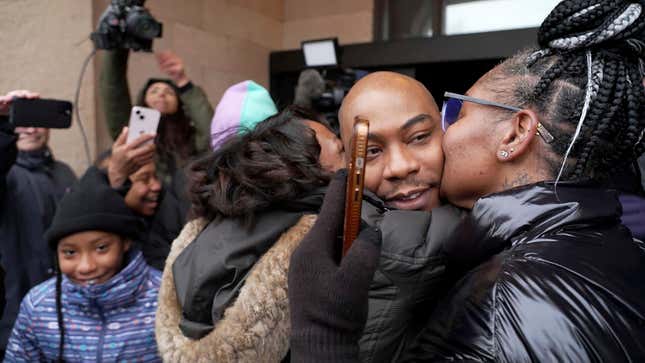 Marvin Haynes, 35, is hugged by supporters as he walks out of the Minnesota Correctional Facility at Stillwater in Bayport, Minn. on Monday, Dec. 11, 2023, after a judge set aside his murder conviction in the 2004 killing of a man at a Minneapolis flower shop. Haynes was 16 when Randy Sherer, 55, was killed during a robbery