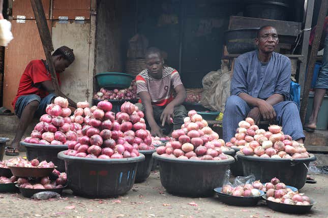 People sell onions at a Mile 12 Market in Lagos, Nigeria, Friday, Feb. 16, 2024. Nigerians are facing one of the West African nation&#39;s worst economic crises in as many years triggered by a surging inflation rate which follows monetary policies that have dipped the local currency to an all-time low against the dollar, provoking anger and protests across the country. (AP Photo/Mansur Ibrahim)