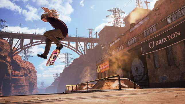 A skateboarder performing an aerial trick in front of a bridge.