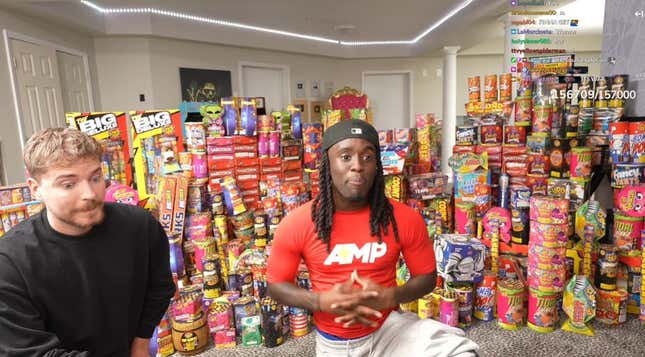 MrBeast and Cenat in front of a vast pile of fireworks.