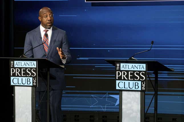 Sen. Raphael Warnock, D-Ga., speaks next to an empty podium set up for Republican challenger Herschel Walker, who was invited but did not attend, during a U.S. Senate debate as part of the Atlanta Press Club Loudermilk-Young Debate Series in Atlanta on Sunday, Oct. 16, 2022.