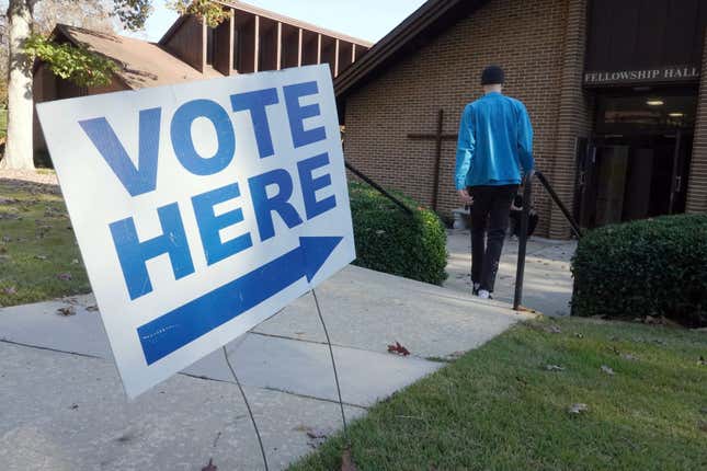 A vote arrives at a polling station at C.T. Martin Natatorium and Recreation Center during the US midterm election, in Tucker, Georgia, on November 8, 2022.