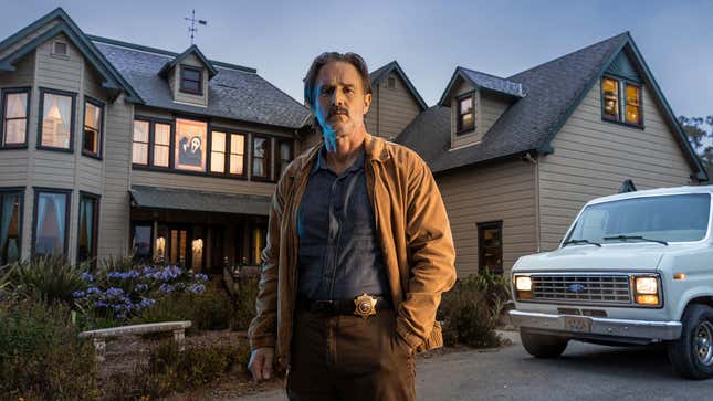 Actor David Arquette stands in front of the original house used in the movie Scream.