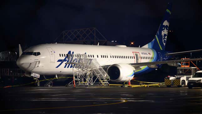 A plastic sheet covers an area of the fuselage of the Alaska Airlines N704AL Boeing 737 MAX 9 that suffered the door plug blowout.