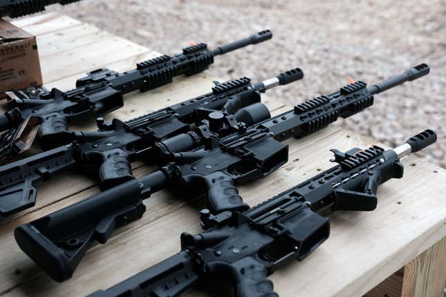 AR-15 rifles and other weapons are displayed on a table at a shooting range during the “Rod of Iron Freedom Festival” on October 12, 2019, in Greeley, Pennsylvania.