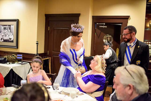 Olivia Pam princess of Aigues Mortes, center, and Prince Jean-Pierre Pichon, right, meet with MicroCon 2017 hostess Queen Anastasia of Ruritania, sitting, during The MicroCon 2017 Gala in Dunwoody, Ga. on June, 24, 2014.