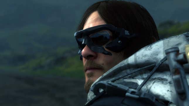 Sam looks off to the horizon while wearing sunglasses.