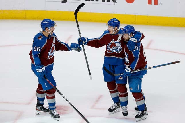 Oct 19, 2023; Denver, Colorado, USA; Colorado Avalanche center Nathan MacKinnon (29) celebrates his goal with right wing Mikko Rantanen (96) and left wing Tomas Tatar (90) in the third period against the Chicago Blackhawks at Ball Arena.