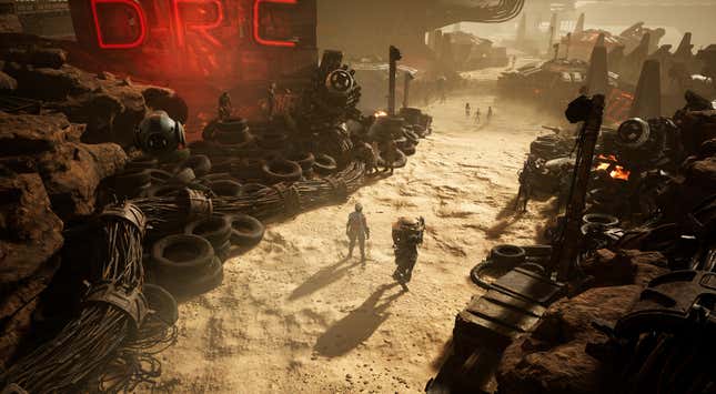 Characters stand around in a desert wasteland.
