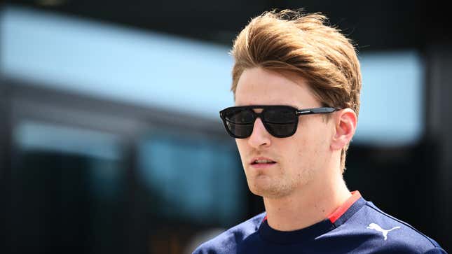 A photo of American F1 racer Logan Sargeant in sunglasses. 