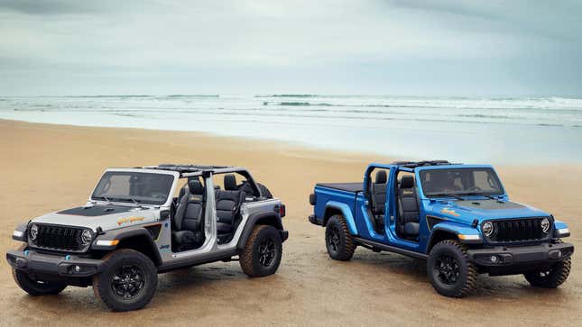 A jeep wrangler unlimited with its roof and doors off parked on a beach next to a gladiator similarly stripped down