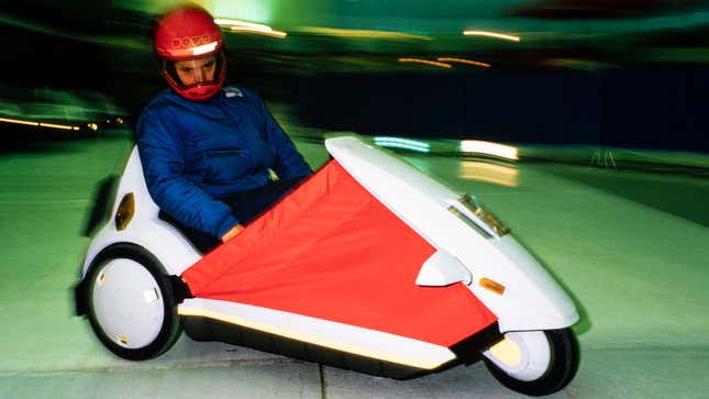 A photo of a Sinclair C5 three-wheeler. 