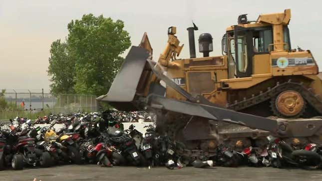 Image for article titled New York City Just Bulldozed A Bunch Of Scooters And Mopeds