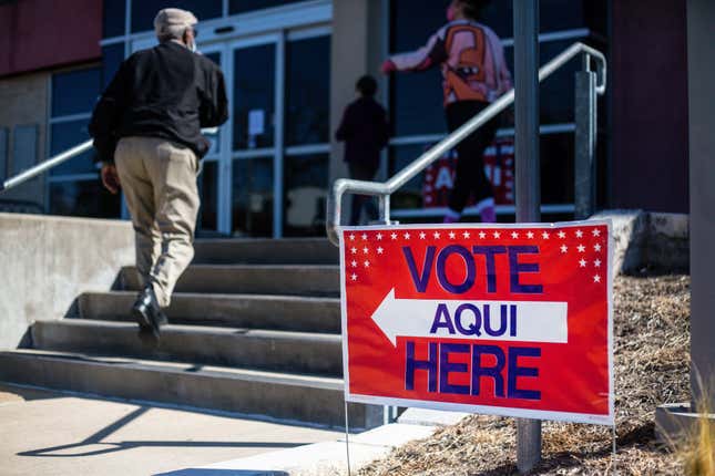 A woman walks to a polling station to cast her ballot in the Texas 2022 primary election in San Antonio, Texas, the United States, on March 1, 2022.