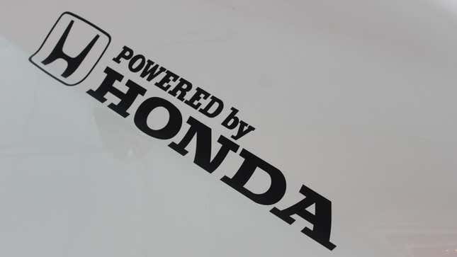 A photo of the Powered by Honda logo on an old McLaren F1 car. 